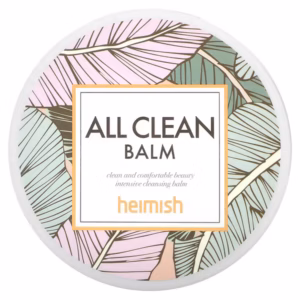 באלם מסיר איפור הידרופילי Heimish All Clean Balm 120 מ"ל – צנצנת זכוכית לבנה עם משחה שקופה, עלים ירוקים ורקע עץ