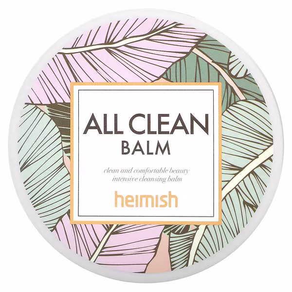 באלם מסיר איפור הידרופילי Heimish All Clean Balm 120 מ"ל – צנצנת זכוכית לבנה עם משחה שקופה, עלים ירוקים ורקע עץ